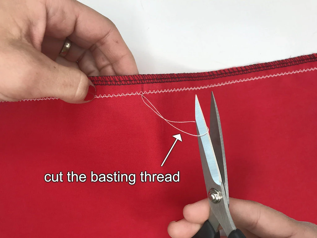 Cutting the basting tread pulled out from zig-zag stitch.