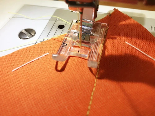 Standard presser foot for sewing parallel stitches.