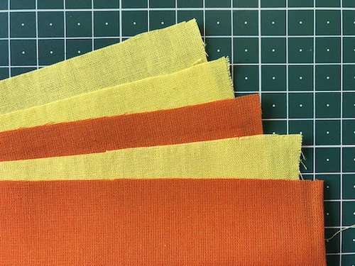 Cotton fabric rectangles that will create the stack of fabrics for sewing.