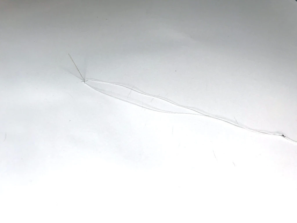 String that will be used instead of a pair of compasses.