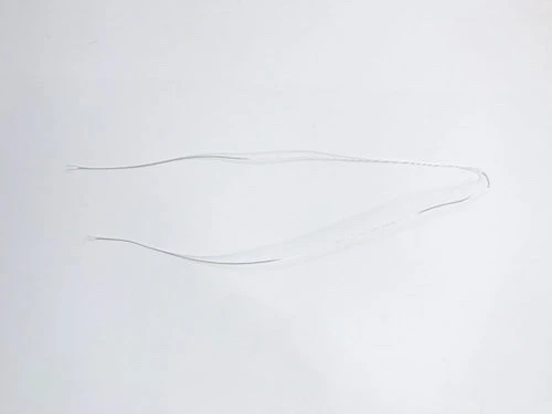 Thin jewellery wire for stringing beads.